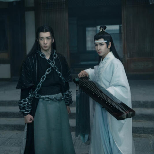 wen ning and lan sizhui stand in combat stances, with lan sizhui readying his qin.